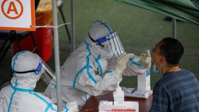 В КНР за сутки выявили 12 случаев заболевания коронавирусом - russian.rt.com - Китай