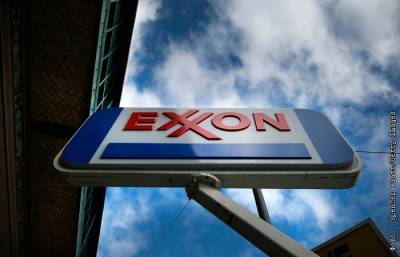 Даррен Вудс - Spencer Platt - WSJ сообщила о переговорах о слиянии Exxon и Chevron - interfax.ru - Москва