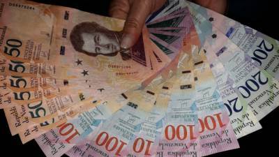 ЦБ Венесуэлы анонсировал выпуск трех новых банкнот - riafan.ru - Венесуэла - Каракас