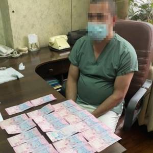 В Киеве задержали врачей, которые требовали деньги при выдаче тела умершей от коронавируса. Фото - reporter-ua.com - Киев