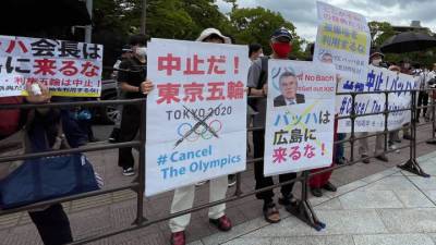 Томас Бах - Прием в честь главы МОК Баха в Токио омрачился протестами - vesti.ru - Япония - Токио