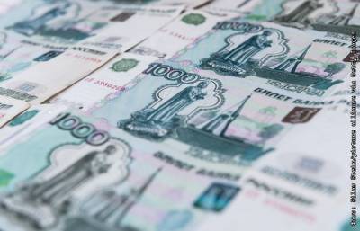 Рубль незначительно меняется к доллару и евро на фоне противоречивых сигналов - interfax.ru - Москва - Сша